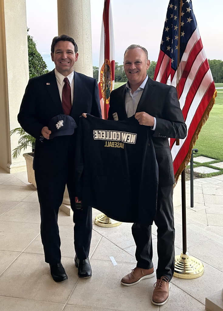 Richard Corcoran and Ron DeSantis demonstrate new Mighty Banyans baseball gear.